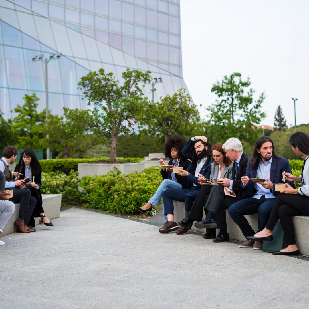 Group of workers eating on their break in a commercial area